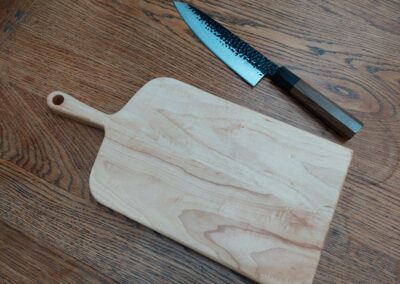This is a handmade maple chopping board by The Wooden Gem.