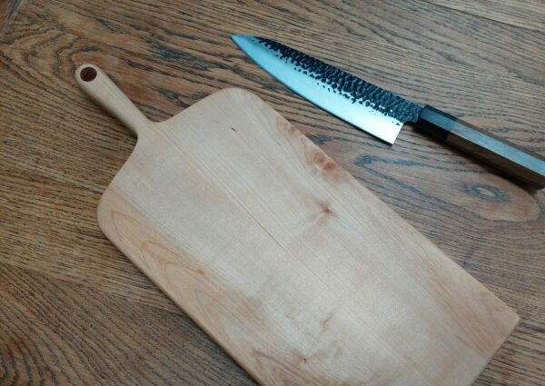 This is a handmade maple chopping board by The Wooden Gem