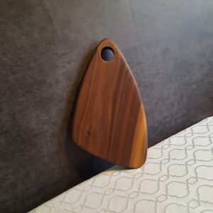 This is a walnut chopping board for perfect handmade wooden gifts by The Wooden Gem.