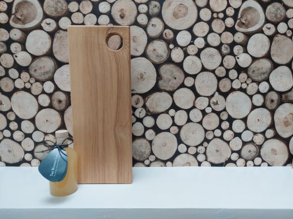 This is a solid handmade ash chopping board by The Wooden Gem.