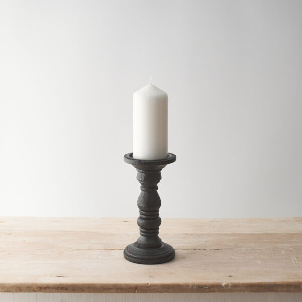 Black wood pillar candle holders at The Wooden Gem.