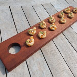 A handmade wooden serving platter and handmade wooden gifts by The Wooden Gem.
